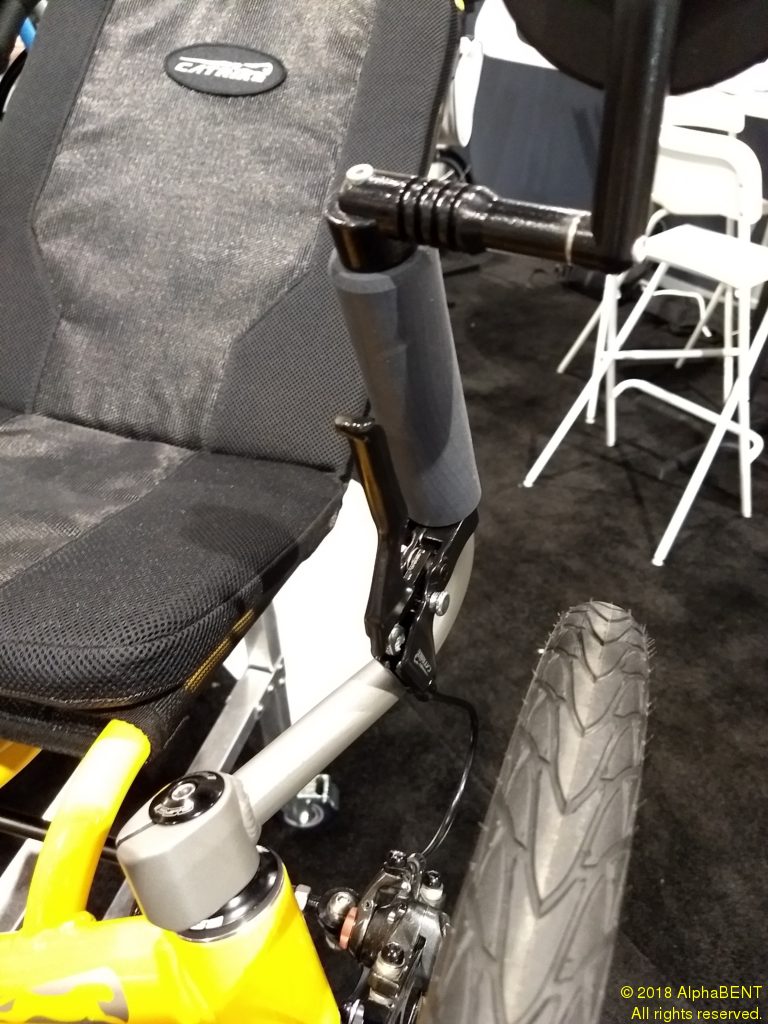 By eliminating the front shifter, the right handlebar is clean and available for a side-view mirror