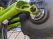 Closeup of Neodrive torque-arm holding wiring harness in place while engaging with the frame.